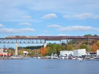 CPR 1401 crosses over the Parry Sound harbour at a snails pace with a 10mph slow order ahead giving us ample time to grab photos. Since this image is just screaming history, the bridge itself was completed by Canadian Pacific in 1907. The trestle itself is 1,695 feet (517 m) long and 105 feet (32 m) high with the first train passing over it in 1908. With those numbers, its reportedly the longest railroad bridge in Ontario, as well as one ( if not ) the longest, East of the Rockies ( I am sure someone will dispute this ) 

1401, although painted and polished into the CPR block scheme and plays the roll VERY well, has a few distinguishable features of a CNR FP9a (6541, which everyone here already knows. Some dead give aways is the bell, horn, as well as I believe the vertical grill slits have some character differences between a standard CPR FP9A and the original CNR 6541. For all the differences, Rapido trains has done a great side by side comparison of a CPR vs CNR FP9a. https://rapidotrains.com/master-class/ho-scale/diesel-locomotives/gmd-fp9a-master-class



