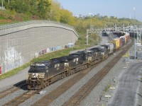 CN 529 has two days worth of CP 931 as it crosses over from the North Track to the Freight track at Turcot Ouest with NS 4306, NS 9927, NS 1017, NS 7630 and 54 cars.
