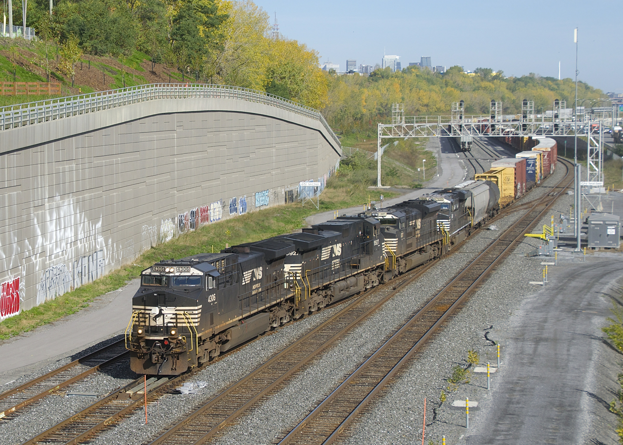 CN 529 has two days worth of CP 931 as it crosses over from the North Track to the Freight track at Turcot Ouest with NS 4306, NS 9927, NS 1017, NS 7630 and 54 cars.