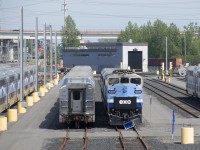 An EXO trainset is blue-flagged at the Pointe-Saint-Charles Maintenance Centre a bit before the start of the afternoon rush hour. In the background is what will be the elevated track for the REM light rail trains.