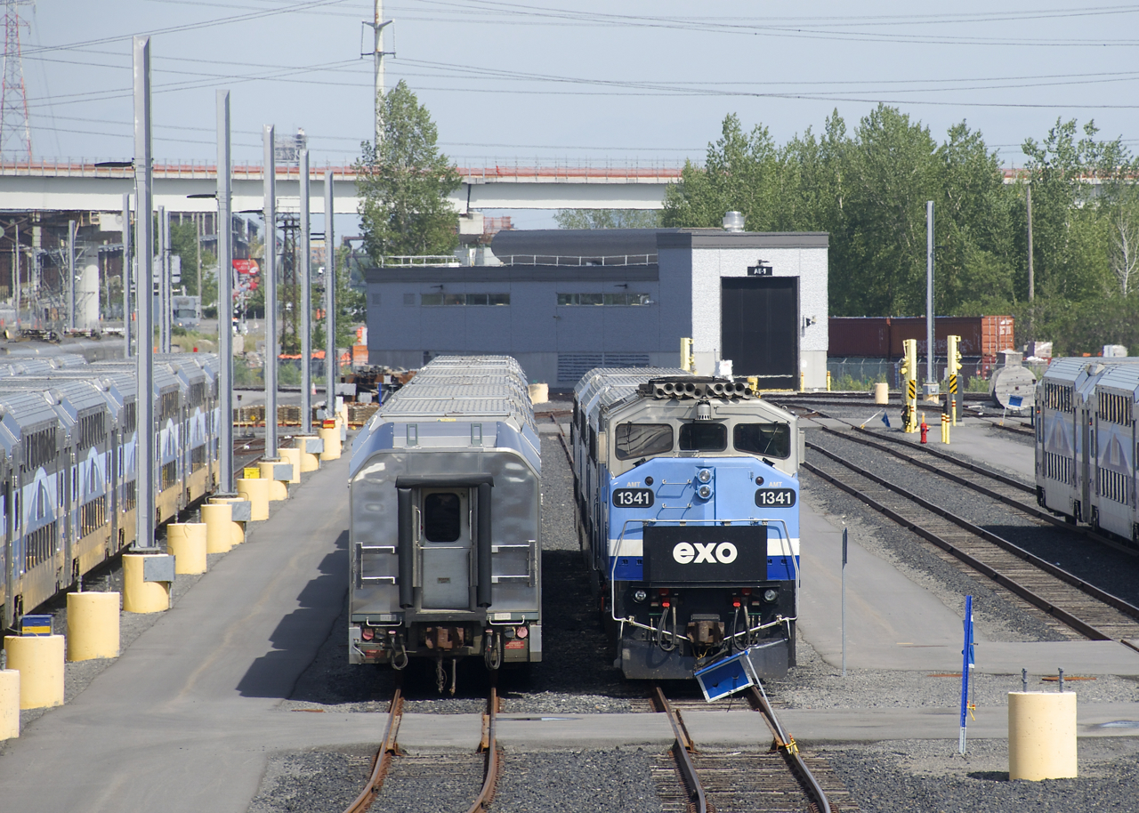 An EXO trainset is blue-flagged at the Pointe-Saint-Charles Maintenance Centre a bit before the start of the afternoon rush hour. In the background is what will be the elevated track for the REM light rail trains.