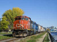 The Pointe St-Charles Switcher is heading east along the Lachine Canal as it shoves grain cars towards Ardent Mills.