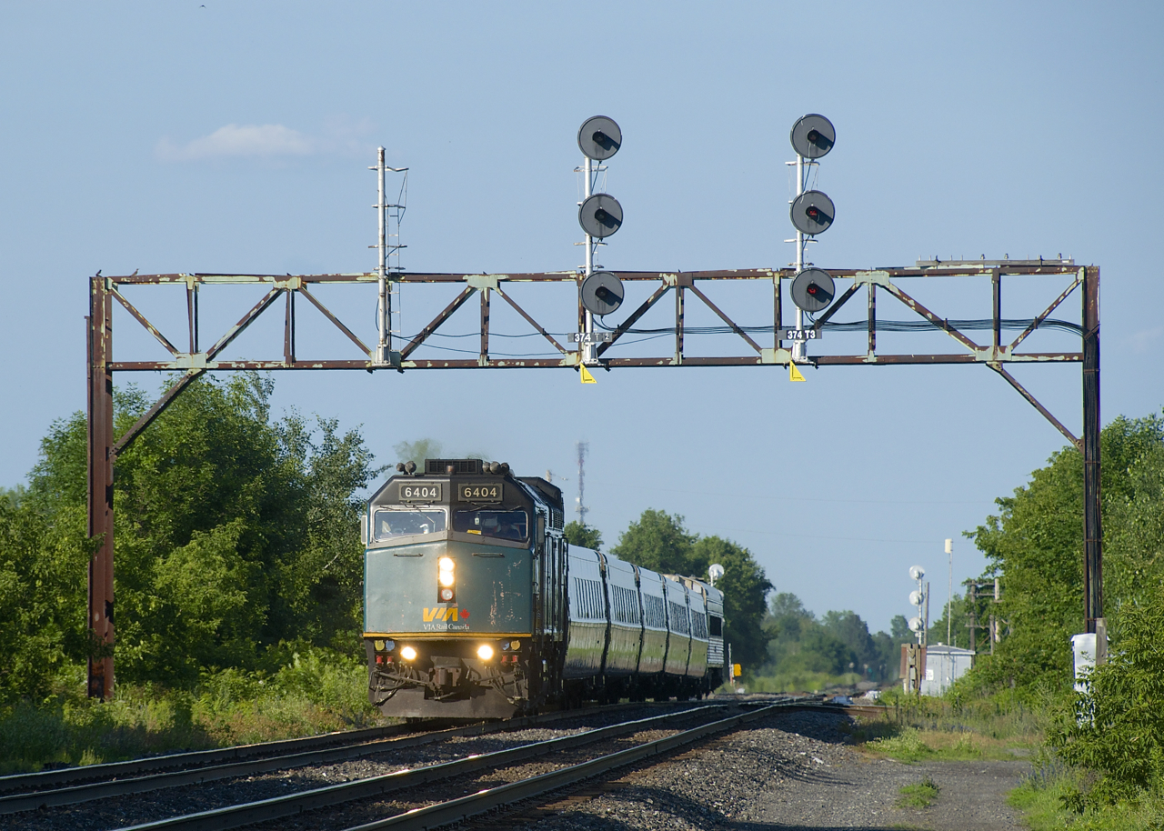 VIA 69 has five LRC cars and a single HEP car as it passes under a vintage signal bridge at MP 37.4 of CN's Kingston Sub.