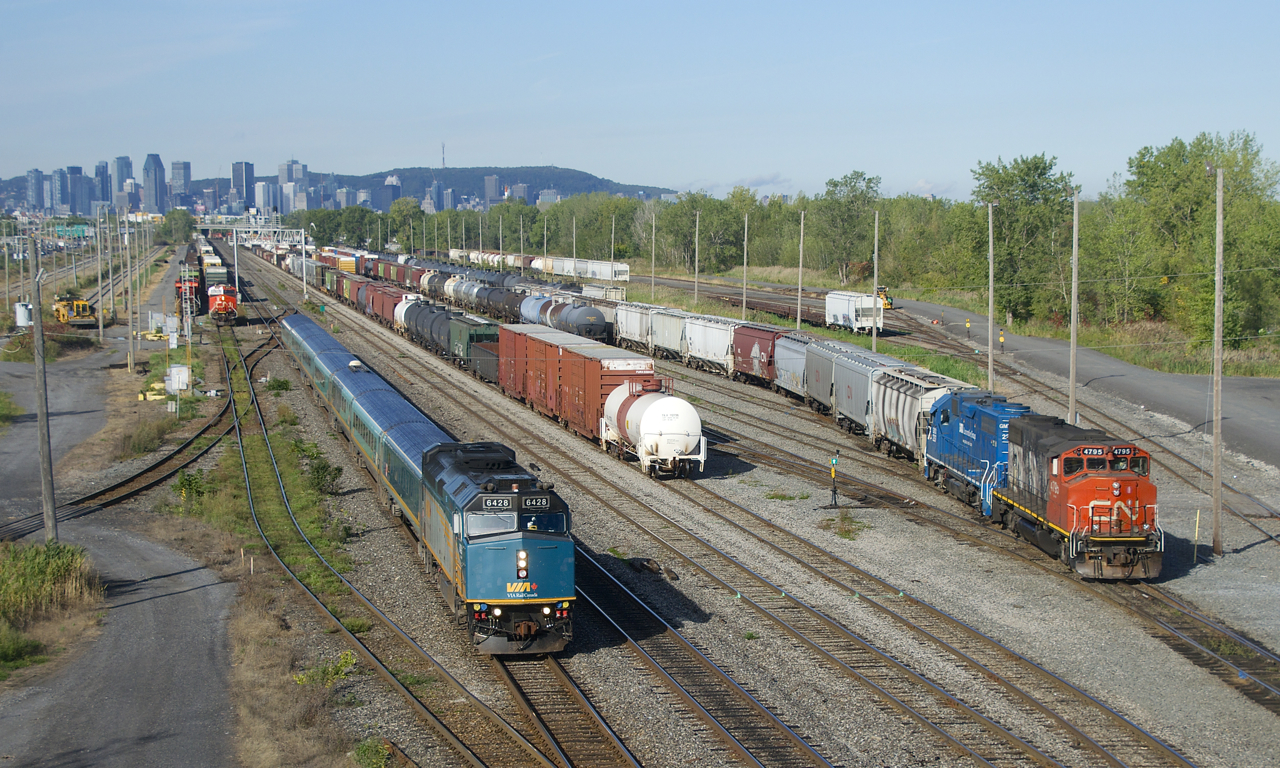 CN 322, VIA 622 and CN 522 are all seen at Southwark Yard on a sunny morning. VIA 622 is heading towards Quebec City with VIA 6428 and a Renaissance consist. CN 522 is getting ready to leave the north side of Southwark Yard before departing for Saint-Jean-sur-Richelieu. CN 322 is about to grab its DPU before heading to the yard office light power.