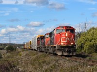CN M397 with SD75i's 5674, 5725, and C44-9W 2639 hauls westbound through CN Mansewood in Milton.