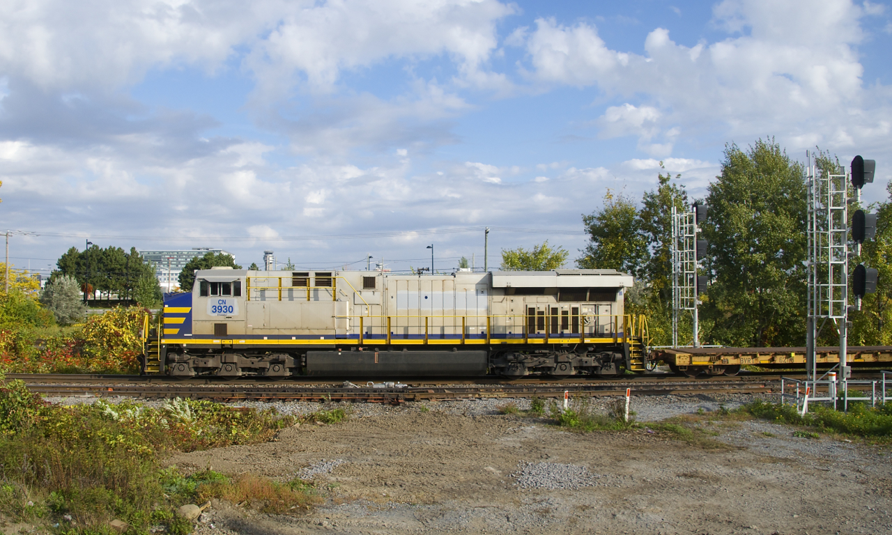 CN 3930 is still in Citirail paint as it leads CN 305 through Dorval.