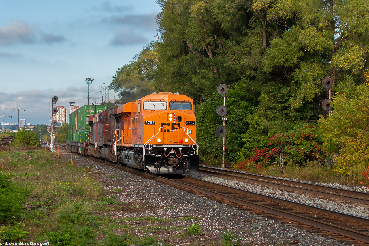 CP 101 moves at a leisurely pace through Leaside with as many intermodal wells as units powering the train (until Vaughan that is). Up front is the 8757, the unit recently repainted into an all-orange scheme and revealed on September 30th, the first annual National Truth & Reconciliation Day, otherwise known as Orange Shirt Day. 
Read more in-depth about the engine and it's story here: https://www.cpr.ca/en/community/every-child-matters-locomotive  

 
Overall I'm pretty happy with this image but next time I'll go for a wider angle for sure.