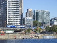 The last inbound train of the morning from Mascouche is passing a not yet active signal gantry with AMT 1347 pushing three multilevel cars.
