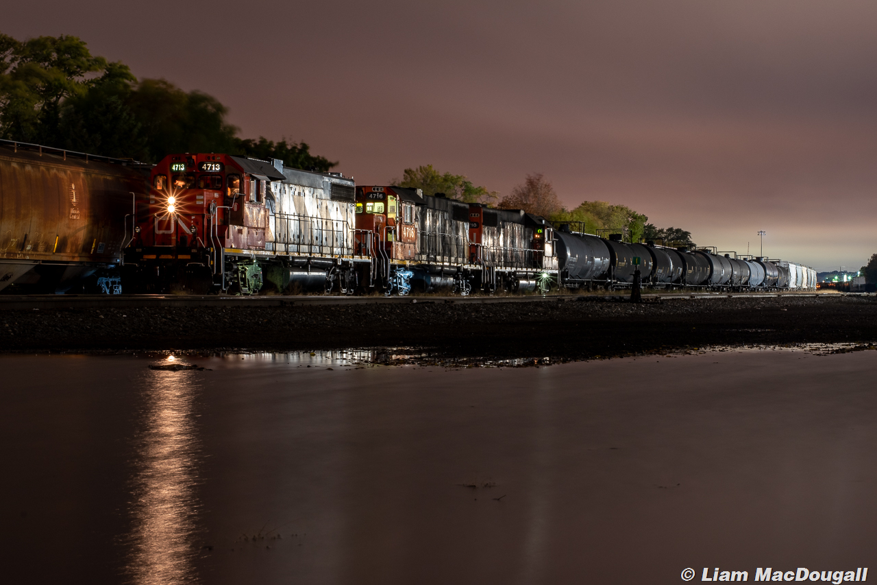 CN L54931 28 with a trio of zebra GP38s rests at Lambton in the dead of night awaiting a signal from CP RTC.