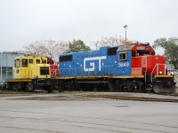 The CN 07:00 job has backed in to National Steel Car to retrieve a cut of new cars as one of NSC's critters waits.  As soon as CN cleared, CP was also going to back in to pick up new cars.  Although it was very dark all day, the clouds actually helped for this photo; had the sun been out I would have been shooting directly in to it.  I hope a GTW beside a NSC tonner qualifies as better than mundane!