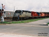 CP 924 reverses to its train approaching the Bond Street crossing in Galt after setting off cars in the once busy yard. The consist included; 5629, 1822, 1861, 8241, HLCX 4290 and HLCX 4406.

