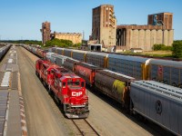 CP 2317 leads for the 1559 Yard Job (conventional crew) as they pass through CP's yard in West Fort. Grain terminals of years past provide the backdrop.