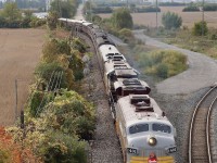 Definitely not the shot I had planned out as I raced towards Vaughan. It has been years since I have been here and apparently the Major Mackenzie crossing is now a bridge. Racing up the bridge I quickly realized I am no longer as young as I once was, LOL. I had hoped for a broadside shot from the west side but the train beat me, nevertheless as the muted sun burned through the trees this ended up being the best option. A consist most could never imagine happening certainly made the trip worth while. To the right is the wye leading into the Vaughan intermodal yard and the new highway 427 extension is in the background, which definitely makes the trip up here a lot faster. A beautiful lash up of old a new along with classic passenger cars really shows that CP is a class act. I'll never get tired of seeing these amazing "F" units. 