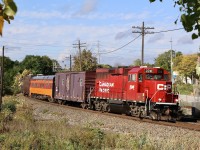 CP TEC train led by GP20ECO 2241 crosses Mississauga Road in Streetsville with a borrowed "Milwaukee Road" coach in the consist. The train is seen traveling from Hamilton to Toronto.