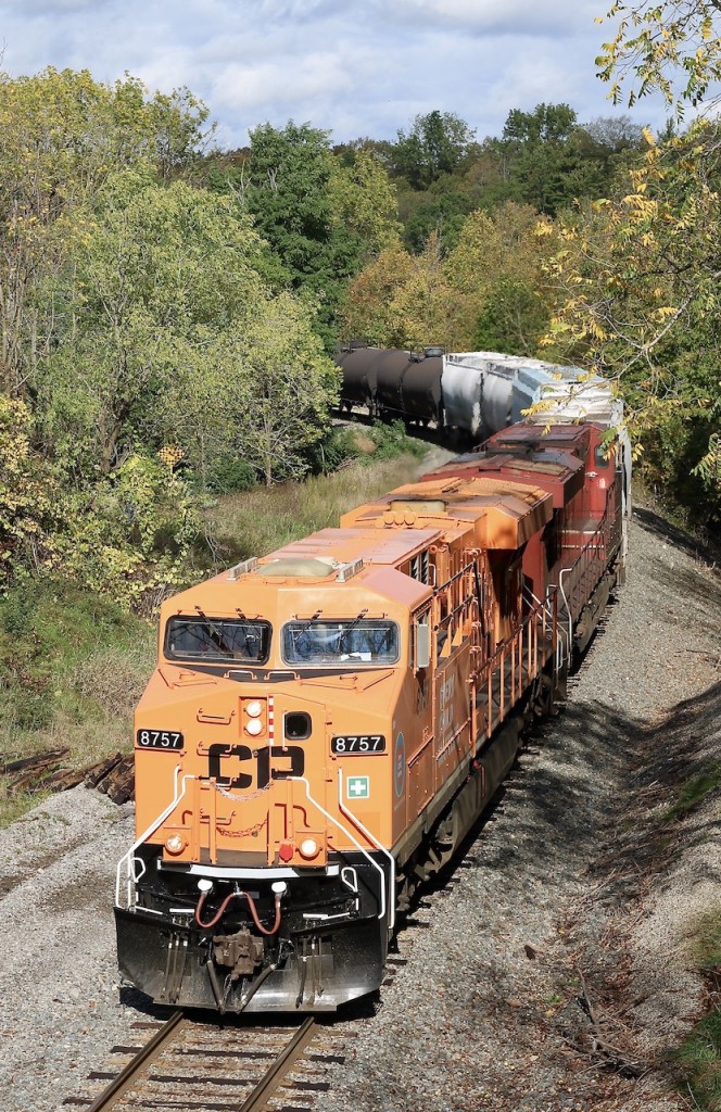 CP "Every Child Matters" unit 8757 leads 254 as it snakes through the gradually changing fall colours in Waterdown, past the one time old elevator location. This is the repainted locomotives first trip along the Hamilton sub. and caught the attention of numerous rail fans this day.