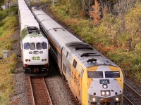 A few minutes of muted sun allowed for a luck break as VIA train 70 swings off the Dundas subdivision and overtakes an eastbound GO train at Bayview Jct. with shades of autumn popping out of what was not so long ago a sea of green.