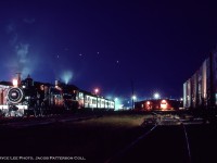 A hissing emanates from within the Owen Sound CPR yard as wisps of steam rise into the crisp air off of Georgian Bay.  The late evening during Thanksgiving weekend in October 1974 finds a pair of steam locomotives resting during a Toronto - Owen Sound and return fan trip run by Ontario Rail.  <a href=http://www.railpictures.ca/?attachment_id=13396>In the morning,</a> the engines will be serviced, turned, and will depart on their return run with a <a href=
http://www.railpictures.ca/?attachment_id=6279>stop at Chatsworth</a> for a runpast.  <a href=http://www.railpictures.ca/?attachment_id=46132>Continuing south,</a> the trip will take a pause around Markdale due to <a href=http://www.railpictures.ca/?attachment_id=46122>an issue with poor quality coal,</a> delaying the trip for an arrival 11 hours late.

<br><br><i>Bryce Lee Photo, Jacob Patterson Collection Slide.</i>