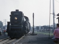 On the weekend of August 30-31, 1958 the National Railway Historical Society (NRHS) annual convention, was held in Toronto, Ontario, Canada.  The Society operated two fan trips on both the Canadian Pacific Railway and the Canadian National Railway, starting both from Toronto, covering many subdivisions of both railways in south-western Ontario. The lens of Edward P. Haines <a href=http://www.railpictures.ca/?attachment_id=44667>captured the CPR trip at Guelph Junction,</a> and the following day, D. R. McCulloch captured the CNR trip at CNR Guelph Junction.<br><br>George Roth, a railfan and sometimes rail historian, was on board of both trips, and has generously recounted some of his memories of the CN operated excursion:<br><br>"This trip was a long ride.  Toronto to Stratford, double-headed with Pacific 5303 & Northern 6247.  After a water stop at Guelph Jct, arrival in Stratford, where we stopped for a good hour or more, while 6247 was serviced, coaled & turned.  We fans wandered over to the shops for a look around before returning to re-board the train of 22 cars.  5303 stayed at Stratford and later in the evening would have likely returned to Spadina roundhouse in Toronto, perhaps on 34 or 36."<br><br>"Facing east, the train then proceeded down the CN Drumbo sub to Paris Jct, onto the Dundas sub to Bayview, then the Grimsby sub, with no stops until St. Catharines.  There, some fans who had previous tickets, boarded the three cars of the Niagara, St. Catharines and Toronto Railway (NS&T) one of them being car 83.  The ticket for this side trip on the NS&T was available as an extra expense. These riders had to be back at the CN St. Catharines to get back on the train a couple of hours later."<br><br>"I stayed on the train and rode to Niagara Falls, where 6247 was serviced and put in the roundhouse.  Northern 6163 was then assigned to the return trip, late day, to Toronto, stopping at St. Catharines to gather the fan riders from the NS&T side trip.  The ride back to Toronto included another side trip across the Beach Strip to Burlington, then, fast on the Oakville sub into Union Station in Toronto.  It was dark by then, but the train was on-time to the NRHS published schedule.  I recall riding in the one open window, first coach behind the baggage cars, and not being able to walk or stand because of how fast we were going."<br><br>CNR 5303, a J-7-c Pacific built by MLW in August 1920, would be scrapped in February 1959.  CNR 6247, U-2-h Northern type, built by MLW in September 1943, was scrapped July 1961.  CNR 6163, U-2-d Northern type built by MLW in April 1936, was scrapped May 1961.<br><br><i>D. R. McCulloch Photo, Jacob Patterson Collection Slide.</i>