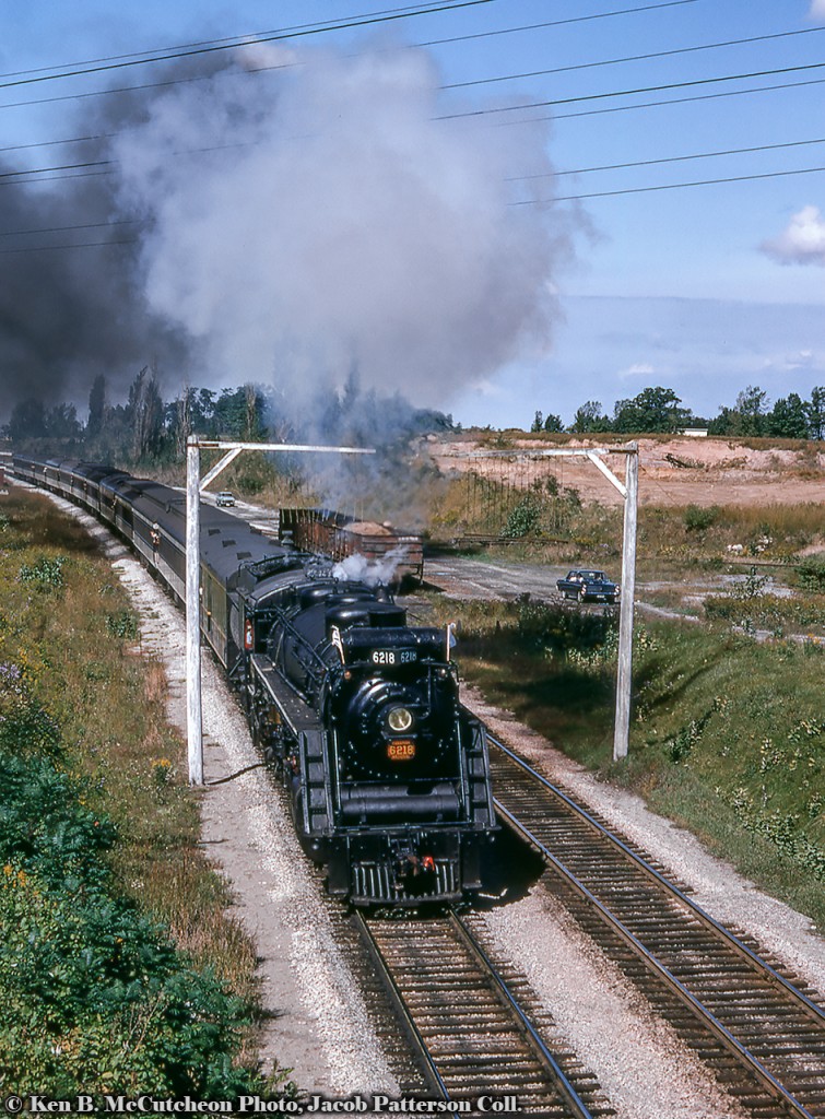 Operating on a Toronto - Niagara Falls UCRS excursion, CNR 6218 ducks under the tell tales approaching Portage Road on the outskirts of Niagara Falls.Ken B. McCutcheon Photo, Jacob Patterson Collection Slide.
