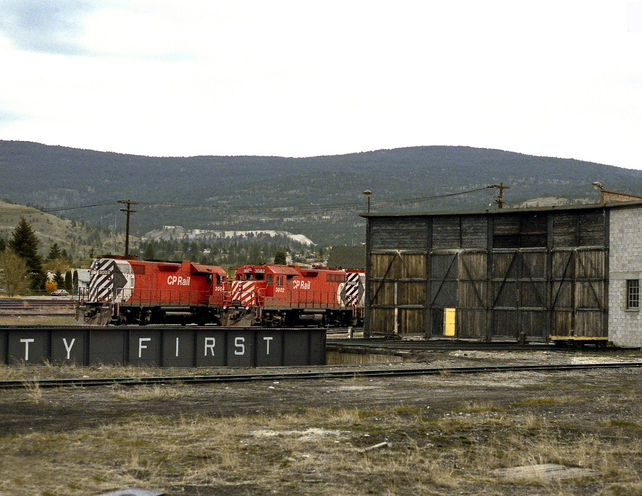 Power for the overnight freight to Spences Bridge and the wayfreight sits by the roundhouse. Penticton was once the Division HQ for the Kettle Valley, but alas all rails have been lifted serving the city