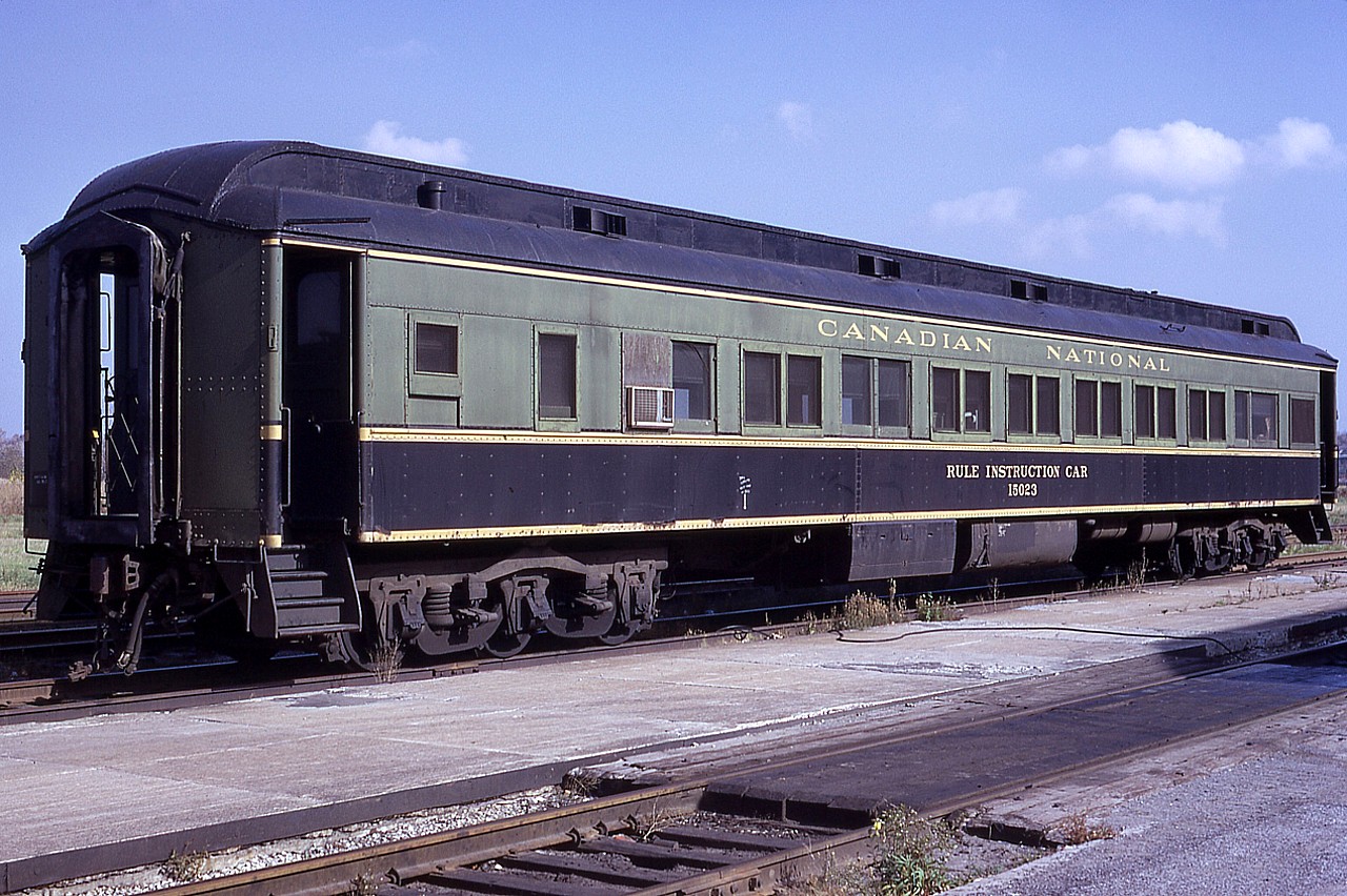 Here's something that these days can only be found at the odd Rail Museum.  A Rule Instruction Car. Mobile classroom !! :o) Best I have been told is that this particular car was a Diesel Instruction car originally.
Besides instruction cars, School cars and Dental cars were also in existence at one time. I understand this particular car was scrapped at Ottawa in 1991 and, despite somehow not labeling my slide thoroughly, see this as being shot by Niagara Falls passenger station. There is a photo on internet of this same car earlier in Fort Erie, so it was probably making the rounds.  Comments invited. I'm not at all familiar with these various pieces of equipment.