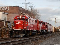 Here's a throwback to just under 4 years ago when transfer jobs used to be a commodity along the North Toronto Sub. Back in 2017-2018 in my early times using a DSLR, I remember seeing yard transfers between Lambton & Toronto Yard multiple times daily, sometimes even more than road trains. Now in the year 2021 I can only count a handful of times seeing one run, and I'd say it probably only happens once or twice a month at most. Unfortunate but it's the way things go. 
<br>
<br>
 Anyways, in this shot we see a beautiful red ex-SOO GP38 leading the way of a westbound transfer through the Bartlett crossing on a chilly December 1, 2017. 