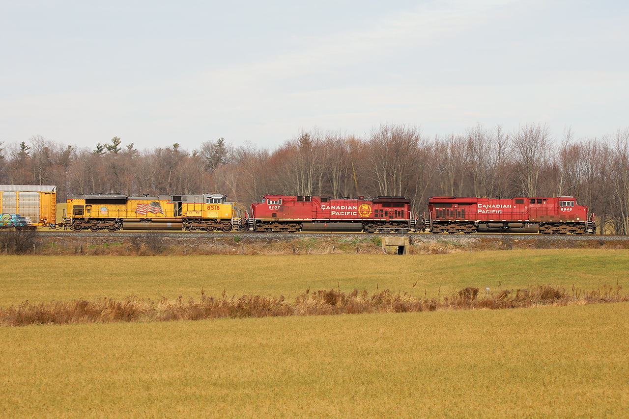 The sun came out for a late-running 234 with some colour in the lashup. The UP came off a 244 the terminated at Wolverton the day before. It will likely turn around and head back to Chicago on 141 or 147 as the varied power pool continues back and forth to the USA. 3 units, 3 paint schemes. Wouldn't it be nice to go back to the days of 3 builders....