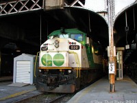 When F59PH's still ruled the roost in downtown Toronto: GO Transit F59PH 520, the first F59PH unit build by GMDD London (Serial A-4745, Glass GCE-430G, Build date 09-88, as per its builder's plate checked that same morning) sits poking out of the 1920's-era "Bush" style train shed at Union Station during morning golden hour, having just arrived nearly half an hour late off Georgetown line train #206 on Track 7. A nice little artifact was that wooden TTR telephone box on one of the poles. Two tracks over, VIA's #1 "The Canadian" sits on Track 9 awaiting its 9am departure for Vancouver. <br><br> An all-too familiar story to anyone commuting precedes this photo: I had caught the morning GO bus hoping to catch morning Georgetown line train #208 at Bramalea at 7:30am, which runs express to downtown Toronto arriving at 7:56am. Usually the bus-train connection was seamless, but it turned out there was extra road traffic enroute and the bus arrived at Bramalea late at 7:35. Well, things were also delayed on the Georgetown line that morning, and earlier train #206 (supposed to depart Bramalea at 7:15, but running 20 minutes late) and #208 (7:30 dep) were both running behind. So we hopped on the first crowded train going downtown, which happened to be #206 with 520 leading, making all stops with trains #270 (7:40 departure) and #208 both following down the single-track Weston Sub from Bramalea to Union. Arrival time at Union was a good 27 minutes late for #206 (normally 7:48, today 8:15) as seen here, and some of the commuters late for work are doing a GO Transit no-no of crossing the tracks at platform level, using the adjacent platform's less-crowded narrow staircase down to the old GO concourse. Just another one of those mornings.<br><br>GO 520 and sister F59's retired two years later: <a href=http://www.railpictures.ca/?attachment_id=16385><b>http://www.railpictures.ca/?attachment_id=16385</b></a>