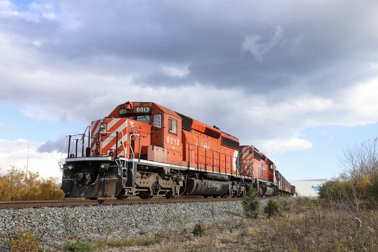 2021.11.03 CP 6013 leading AWB-03 ballast work train, CP 6030 trailing, dumping ballast on Oshawa Spur.