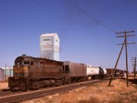 Single unit operation has always been photographically appealing to me, with GP9s fairly common in British Columbia, and in Alberta also the odd MLW.  So it was a happy encounter finding the daily wayfreight No. 83 from Medicine Hat arriving Lethbridge with a single script albeit grubby C-424 4204, seen here on the eastern outskirts of town on Thursday 1974-10-03.