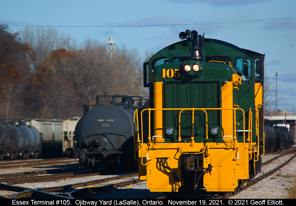Lunch Time.... Essex Terminal SW1200 #105, paired with SW1500 #107, looks sharp in it's new paint as the crew takes their lunch break from working Ojibway Yard in LaSalle, Ontario today.  Shortly the pair will head to the east end of the yard and then head in to switch the large ADM facility located to the north of this photo.
