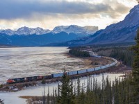 M 34851 26 rolls along the Athabasca River, trading the spectacular scenery of the Rocky Mountains for the foothills of Alberta.
