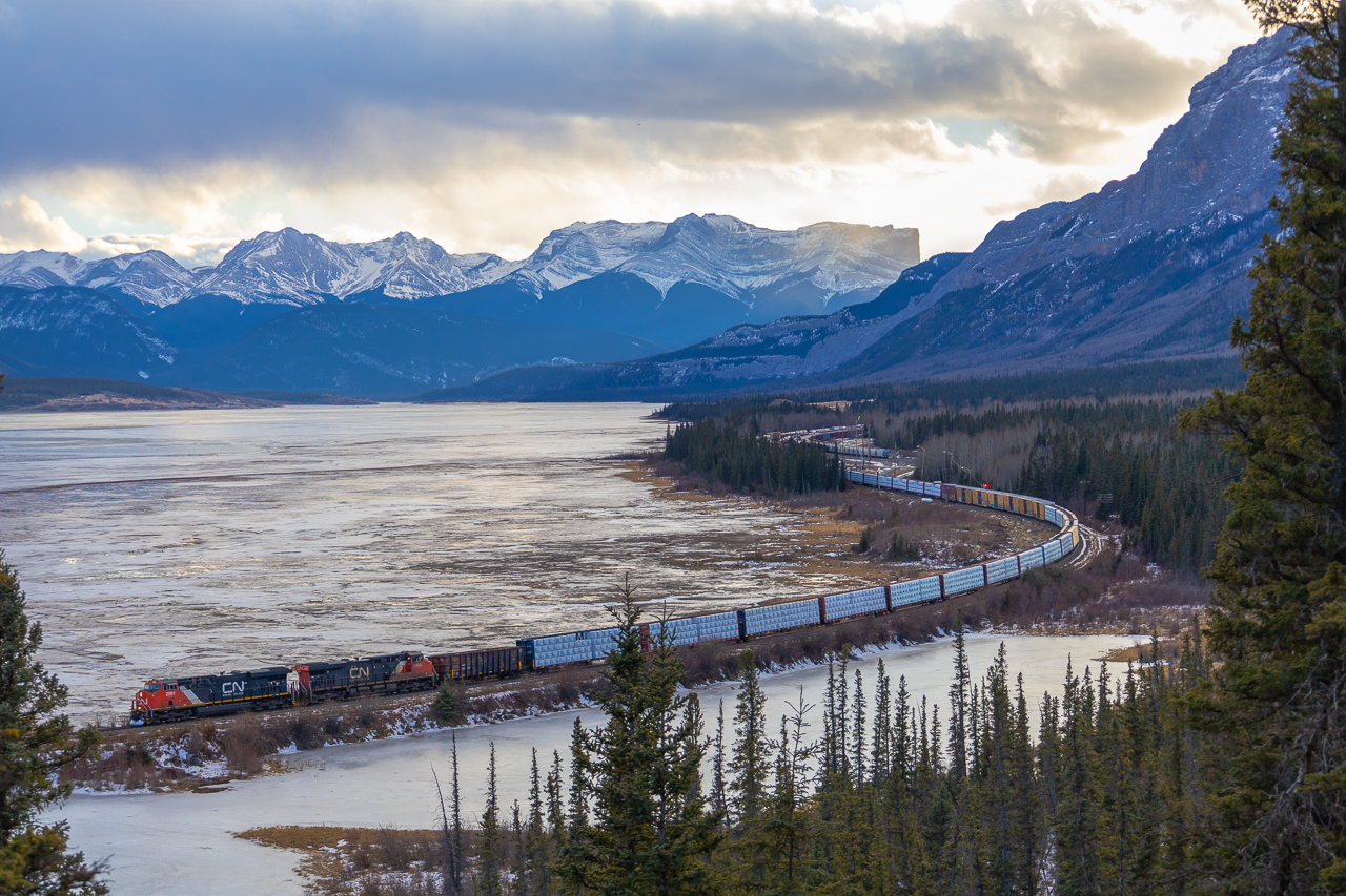 M 34851 26 rolls along the Athabasca River, trading the spectacular scenery of the Rocky Mountains for the foothills of Alberta.