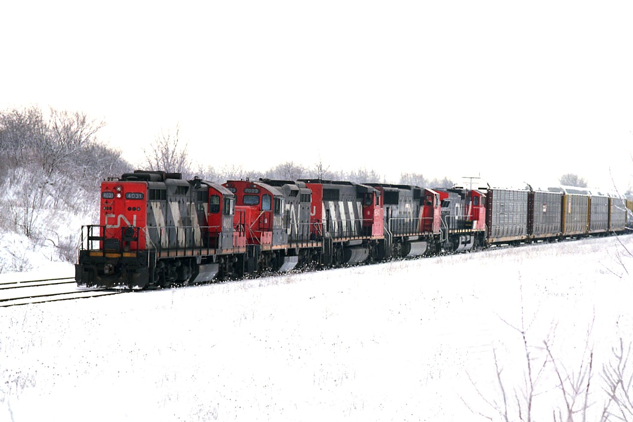A blustery January day down at Fort Erie.  I'm on the hillside near the west end of the yard watching a CN train pull away with quite the mixture of power. CN 4031, 7023, 9541, 5601 and 2559. Nice to be rewarded for going out in such lousy conditions.