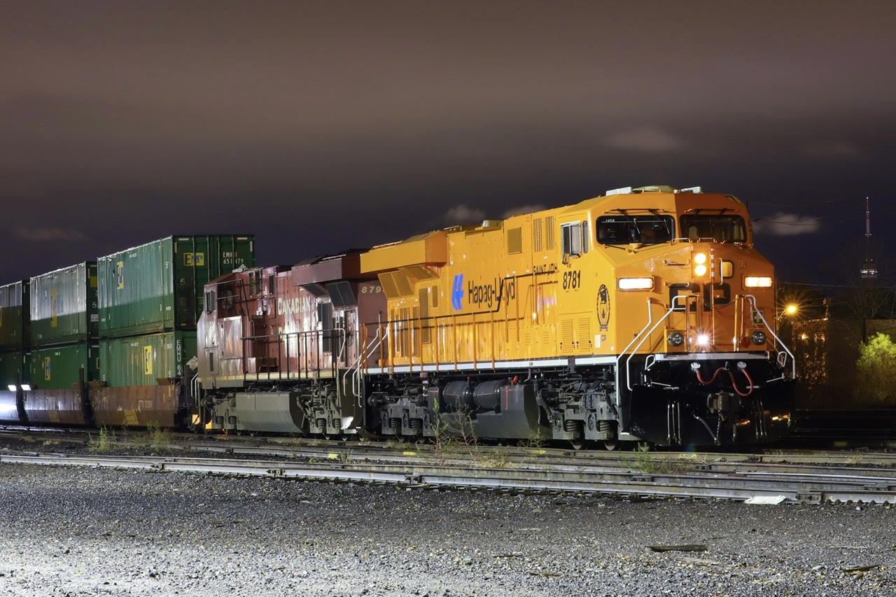 2021/11/18 CP 8781 leading CP 143-17, CP 8793 trailing, working at CP Lambton Yard. You can barely see CN tower in the background.