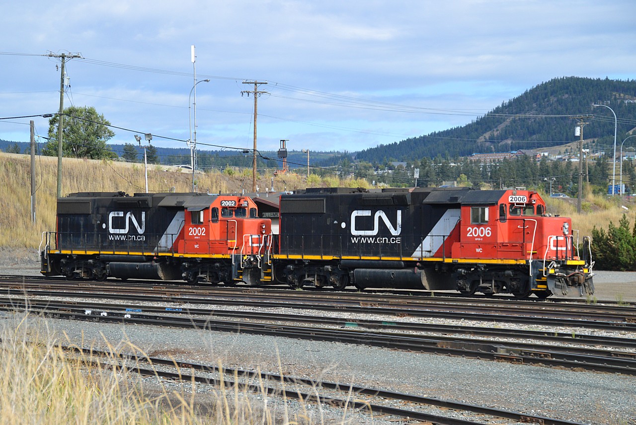 Rolling into the BC town of Williams Lake, I was rather surprised to see these two engines in the yard. I guess because they must be stationed mainly in the west, I was not aware of their existence. According to the Trackside Guide there are 6 of these; GP38-2 models acquired when CN took over the Wisconsin Central in 2001. Series 2001 to 2006. Of course not to be confused with the CN Dash-8s in the 2000 series.  The GPs are sublettered "WC", but still; it threw me off for a bit. I would have thought these would be renumbered.....  Did manage to catch 2003 as well; that one still in Wisconsin Central paint. CN 2002 and 2006 basking in the sunshine.....I hoped for a freight to come into town with a 2006 leading of course, but incredibly remote chance of that.!!