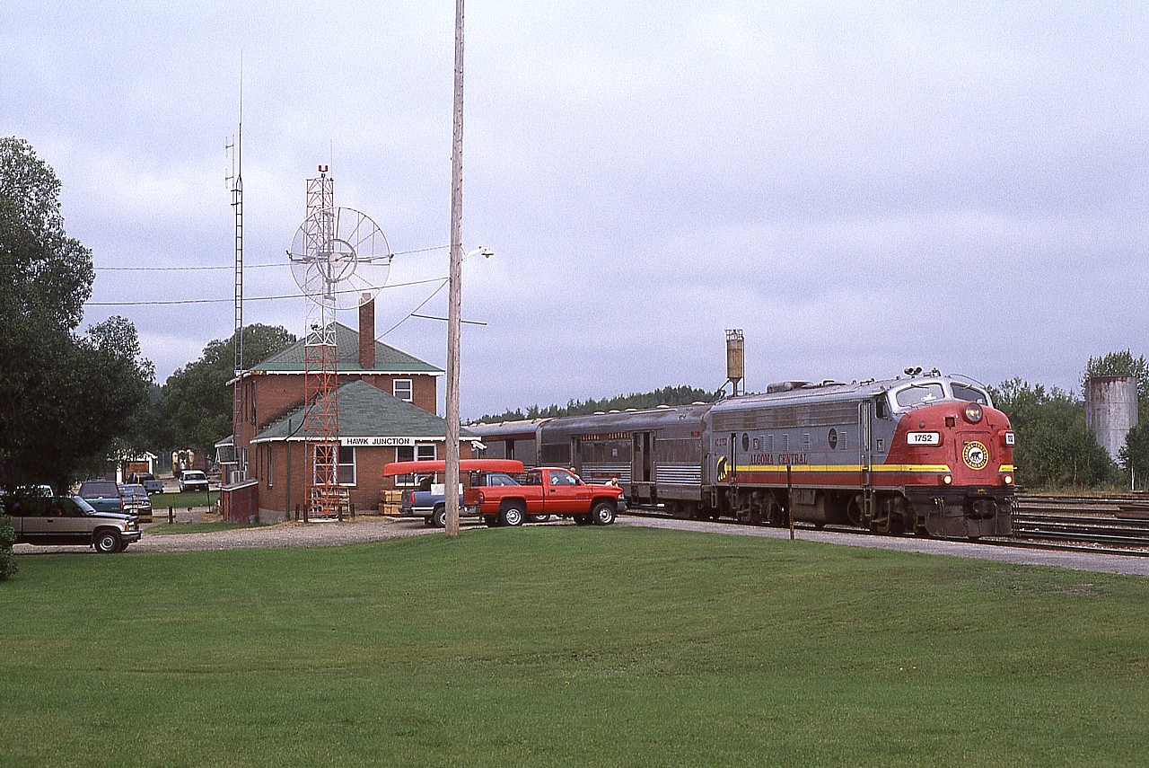 AC FPA 1752, formerly VIA 6511, waits at the Hawk Jct for passenger exchange to be completed before moving off southward to Sault Ste. Marie.  Generally it was about a 15 minute layover here, which gave time to get any necessary photos.
This view shows Hawk Jct in much, much better days. Things are cared for; the station, the grounds, and even the village had a positive appearance.  Today, this place is in shambles. The main street is gone; no business left; although I hear rumours the Black Bear Hotel has reopened.  Now under CNs control, it is like a wasteland around the railway, which directly affects the community. Freight service is gone, passenger service is pretty well kaput; and if it was not for the fishing, hunting and cabin rentals; Hawk Junction would literally be a ghost town.  A real shame. It is the North. Nobody cares. Hopefully a rebound in mining in the general area might put a few of these forgotten communities back on the map someday.