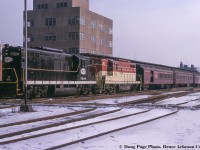 January 14, 1967 was a special day for fans of the Toronto Hamilton & Buffalo Railway, as the Upper Canada Railway Society ran an excursion covering TH&B and NYC lines (NYC owning 73% of the TH&B, CPR the other 27%) in Southern Ontario, and included utilizing an NYC GP9 on the point.  Here, the train waits to depart Hunter Street station for the first leg of the trip, Hamilton - Waterford.  From there, the train will run east on the NYC's CASO to Welland, where it will turn back west on the TH&B going Welland  - Hamilton.<br><br>Bill Thomson shot <a href=http://www.railpictures.ca/?attachment_id=24049>the train at "Summit"</a> near Copetown.  Stay tuned for Doug Page's shot just across the tracks from Bill.<br><br><i>Doug Page Photo, Bruce Acheson Collection Slide.</i>