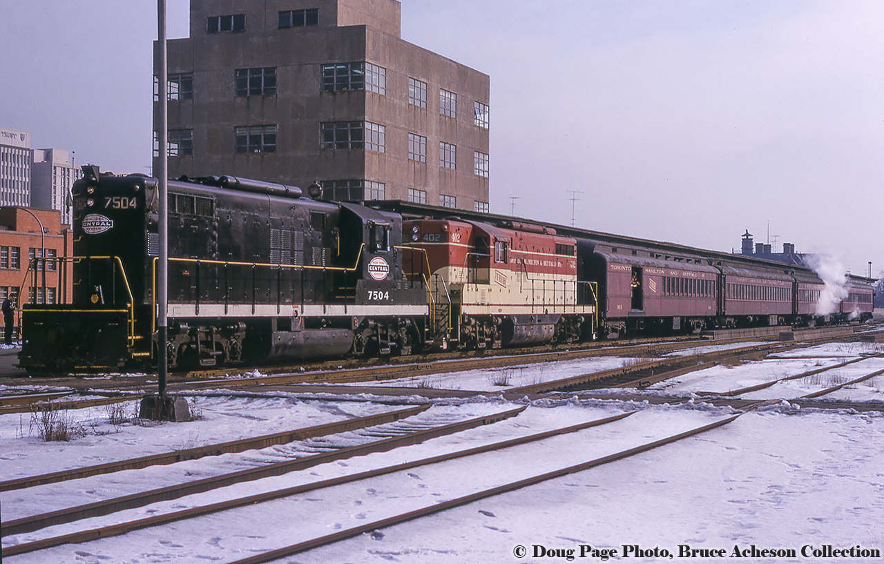 January 14, 1967 was a special day for fans of the Toronto Hamilton & Buffalo Railway, as the Upper Canada Railway Society ran an excursion covering TH&B and NYC lines (NYC owning 73% of the TH&B, CPR the other 27%) in Southern Ontario, and included utilizing an NYC GP9 on the point.  Here, the train waits to depart Hunter Street station for the first leg of the trip, Hamilton - Waterford.  From there, the train will run east on the NYC's CASO to Welland, where it will turn back west on the TH&B going Welland  - Hamilton.Bill Thomson shot the train at "Summit" near Copetown.  Stay tuned for Doug Page's shot just across the tracks from Bill.Doug Page Photo, Bruce Acheson Collection Slide.
