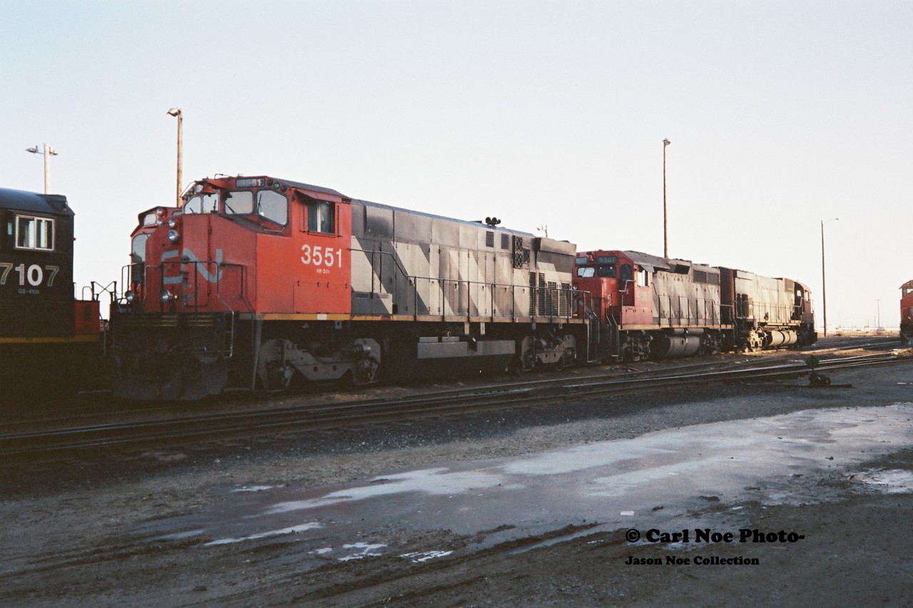 CN 3551 with its green class lights on, CN 9307 and an M636 await departure from the MacMillan yard diesel facility in Toronto, seen during an early winter afternoon. It would be interesting to know if this consist was assigned to a westbound train in Southern Ontario or was headed east on the Kingston Subdivision to Montreal.