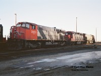 CN 3551 with its green class lights on, CN 9307 and an M636 await departure from the MacMillan yard diesel facility in Toronto, seen during an early winter afternoon. It would be interesting to know if this consist was assigned to a westbound train in Southern Ontario or was headed east on the Kingston Subdivision to Montreal.

