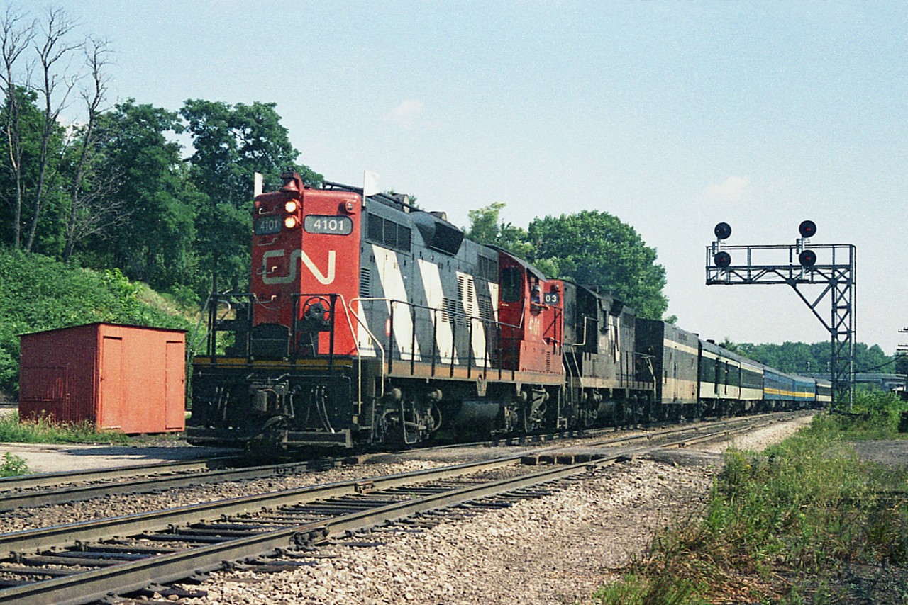 What's this? A full-fledged passenger train heading to Hamilton and Niagara?  Nope.  Much to the chagrin of a full house of enthusiasts; the CN steamer 6060 was "down" on this day and CN 4101 along with 4103 subbed for the excursion to NF and back.  Yeah, all of us characters trackside were disappointed as well, but in the end, we were treated to "something different" rather than the same old Bullet Nose Betty. :o)
