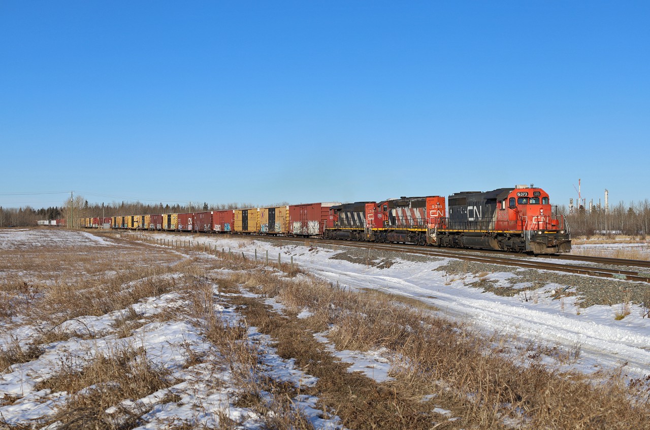 L 52251 27 with CN 5373, CN 5295 and CN 5354 are on the final approach to Scotford Yard, with a 203 car, 13556ft transfer from Edmonton Walker Yard.