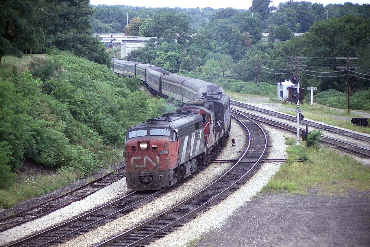 It is still early in the days of the newly formed 'VIA' system, and in this image one can only spot the B unit and a couple of coaches in the new paint scheme. Almost every day the late afternoon #75 impressed. Today is Aug 30/78, a Wednesday; and yet CN 6780, 4100 and 6864 have to deal with 10 coaches, a decent sized train. I spent a lot of time plopped on the hillside here.  And no ticks back then, either.