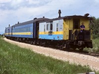 The tail end man is enjoying a warm summer day as No. 91 arrives at Kerensky and the Jct. with the Lac La Biche Sub. Cab 79101 did not have many trips left to go, she will be replaced by CN cab 79881, which held this duty until No. 91 was pulled. How great it was to have all the poles cut down, this became a prime afternoon location. Taken at 13:30, with the 5588 (now 4788) up front.