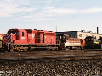 In early morning light, CP SD40 5555 and former TH&B NW2 51, along with former Port Stanley Terminal Rail SW9 L3 share shop tracks at CP’s Agincourt Yard in Toronto, Ontario. Both switchers were part of the first unit’s ever owned by the Ontario Southland Railway, (OSR) which at the time according to the 1995 Trackside Guide was only in the locomotive and car leasing/storage business. 