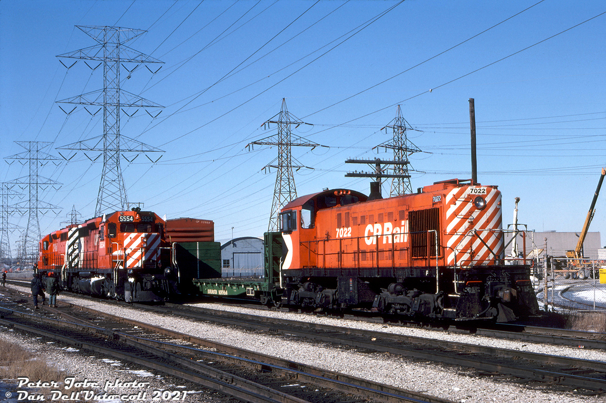 CP Rail 7022, one of the regular old Alco S2 switchers assigned to downtown Toronto's John Street Roundhouse for Toronto-area industrial switching, works the Obico Industrial job on the Canpa Subdivision near the south end of Obico Yard. Sitting nearby are CP SD40's 5507 and 5554, today's power for the Toronto-Hamilton "Starlight".

Behind 7022, a spur leads into Ontario Hydro's sprawling property along the Canpa Sub on the west side of Kipling, north of Queen Street and south of the Manby Transformer Station (see the far left side of this 1968 aerial). Most if not all of the old HEPC property has since been sold off, and the rail spurs inside the grounds and to the nearby transformer station have all been removed.

Peter Jobe photo, Dan Dell'Unto collection slide.