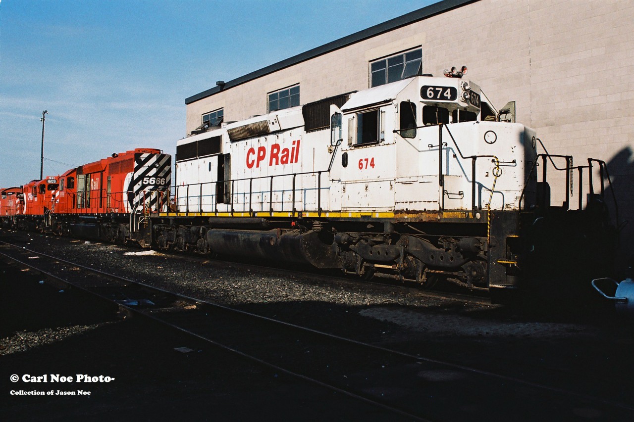 Former Kansas City Southern Railroad SD40-2 674 awaits it’s turn for work at CP’s Toronto yard diesel shop along with SD40-2 5666 and GP9u 1609. “White CP” SD40-2 674 went on to become CP 5419 and was eventually sold to National Railway Equipment following retirement.