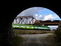 Holy happenstance Batman! Meanwhile....at the batcave. Yes, we know it as the batcave. I am actually standing underneath 2 tracks of CN's Kingston Sub just west of Liverpool where the York Sub meets the Kingston Sub. I was trying to capture the westbound GO/ Metrolinx commuter train on the GO Sub as it approaches Durham Jct when a westbound CN freight popped into the frame. CN SD70M-2 8016..aka thunder wagon is just about to cross over The Worlds Busiest Highway at Liverpool as it starts its 10 mile climb up to McCowans and onward to Mac Yard.