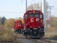 After spotting cars at the only two clients left on the Lasalle Loop Spur (Fleischmann's & Total Canada), both of CP F95's units are leaving light power, separately but simultaneously (they will couple up together in a short distance before heading back to St-Luc Yard). One (or possibly both clients) on this line has to be switched with only one unit, explaining why these two units were temporarily split up. The track branching off to the left goes to Fleischmann's.